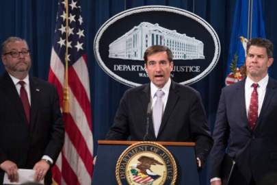 U.S. Assistant Attorney General for National Security John Demers (C) speaks during a press conference announcing the “China Initiative” to crack down on Chinese espionage at the Justice Department in Washington, on Nov. 1, 2018. (Jim Watson/AFP/Getty Images)